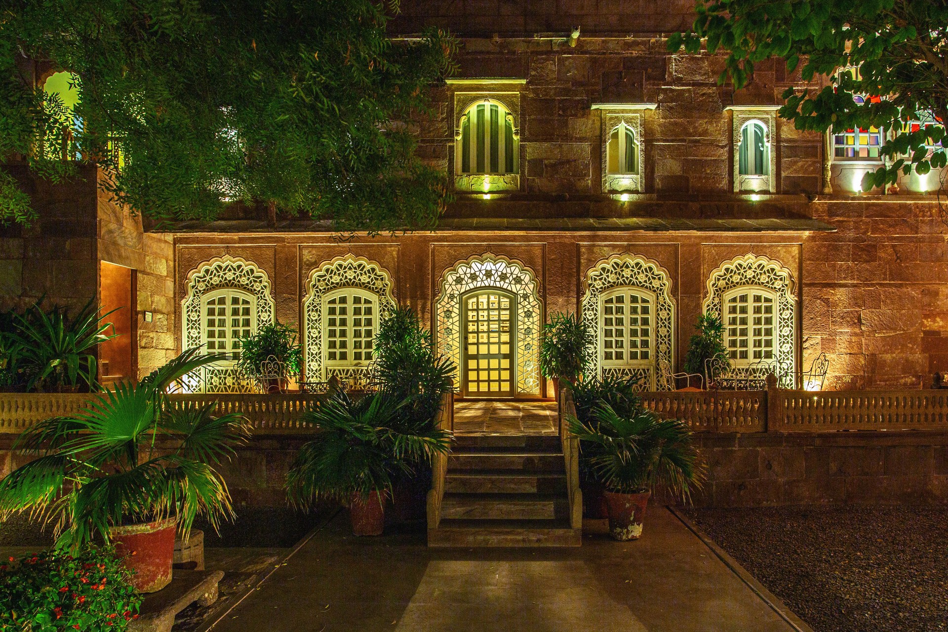 Historic Indian mansion with authentic Mughal details - intricate Rajasthani architecture at night in India