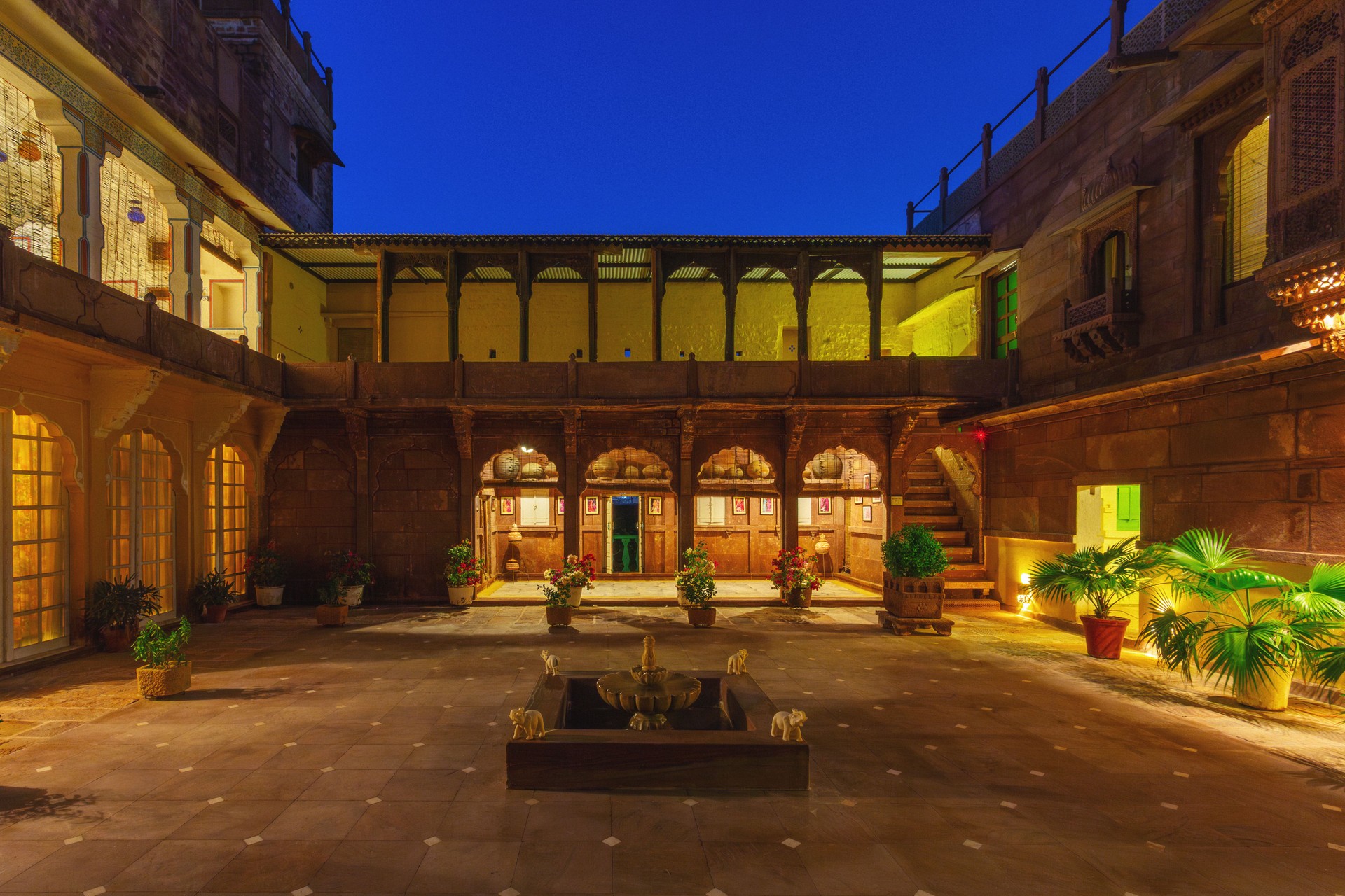 Historic Rajasthani mansion courtyard - authentic ornate architecture at twilight